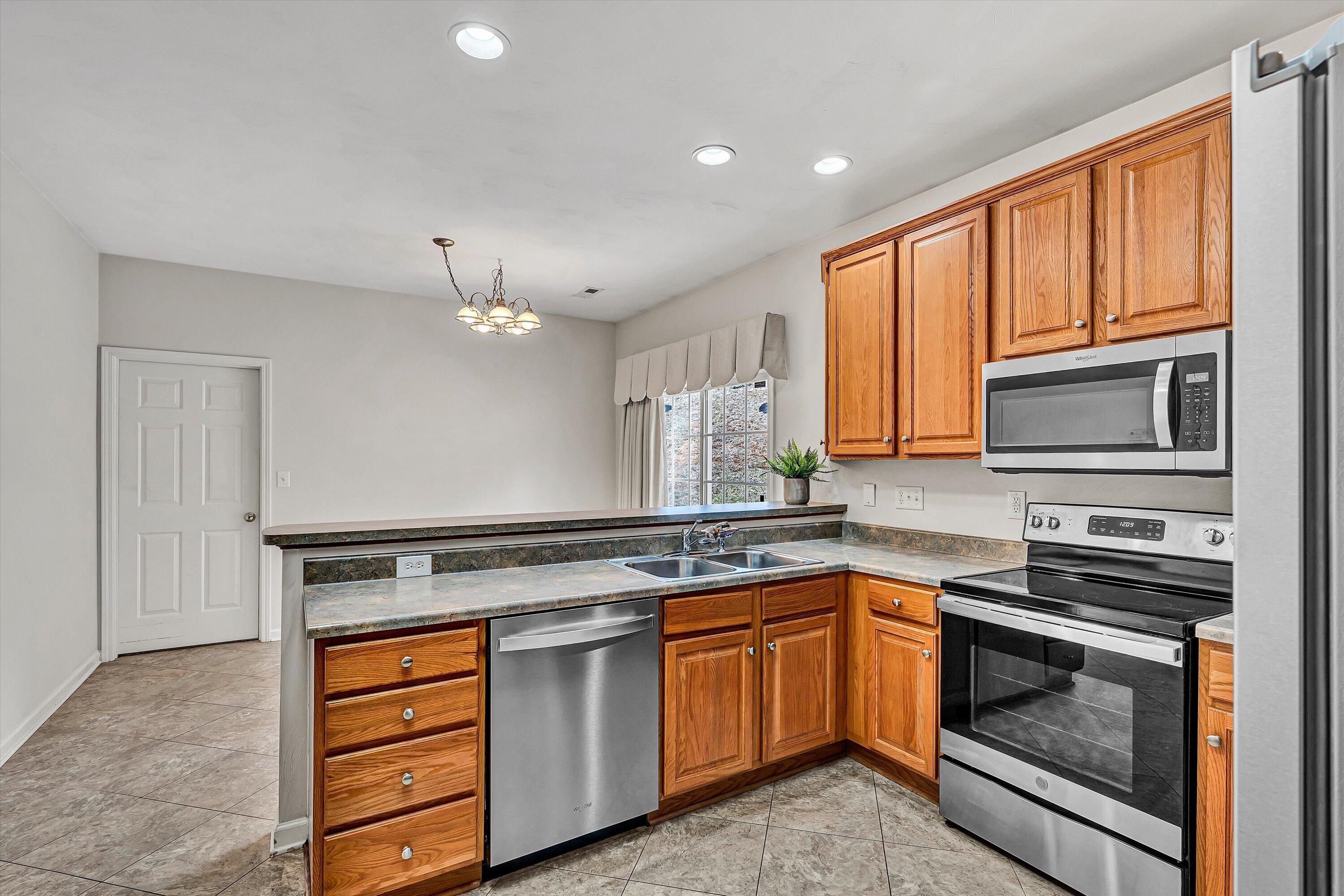1365 Aarons Run Circle Salem, VA 24153 - Photo 13 of 35 a kitchen with granite countertop stainless steel appliances and sink