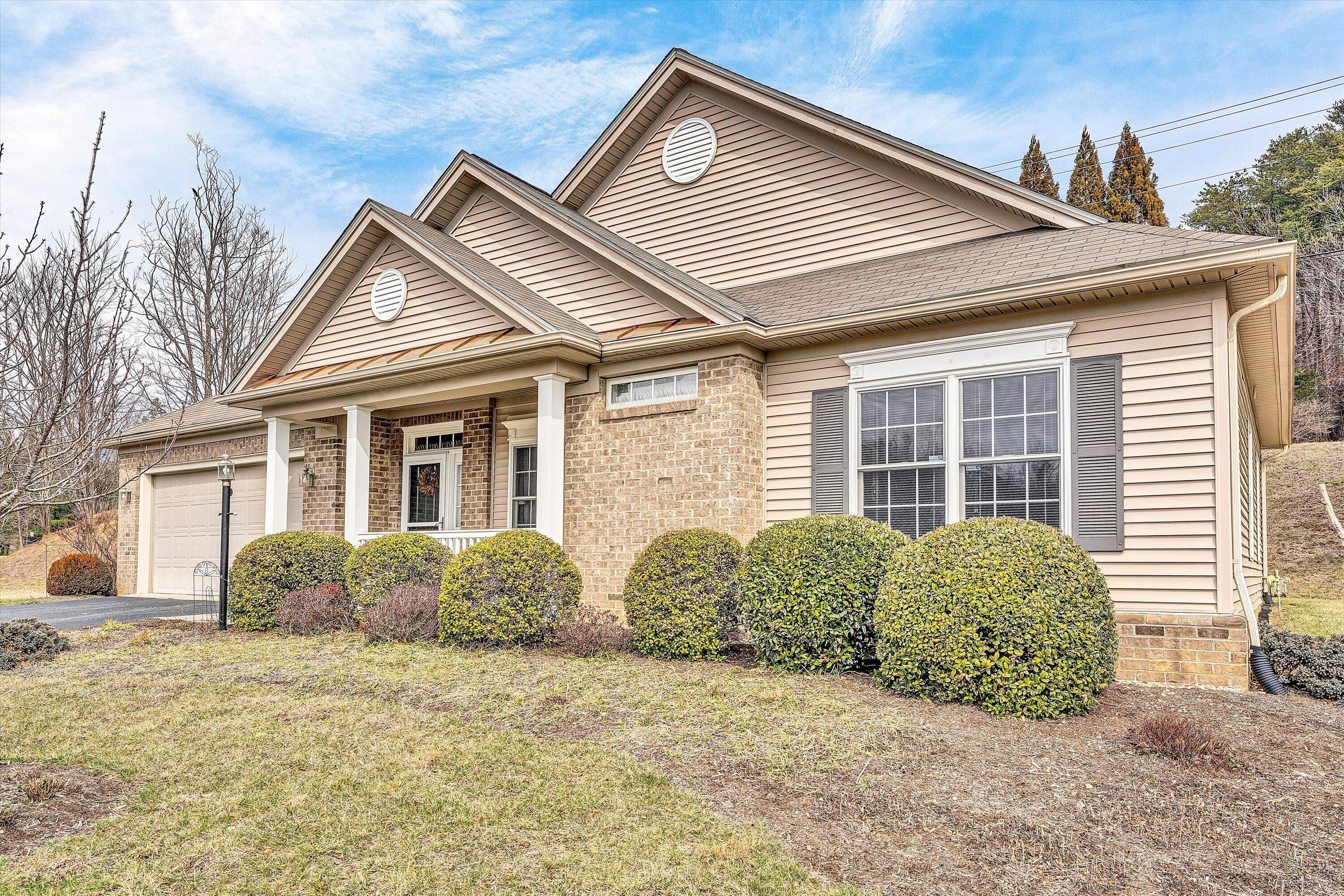 1365 Aarons Run Circle Salem, VA 24153 - Photo 4 of 35 a front view of a house with a garden
