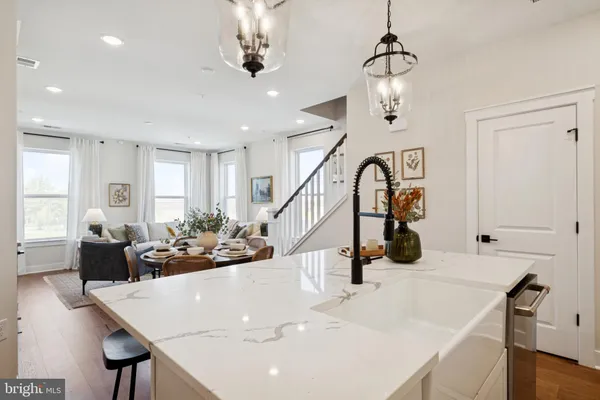 a view of a dining room with furniture and chandelier