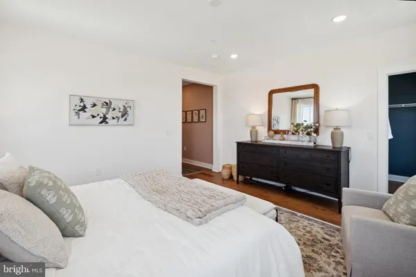 a bedroom with a bed and a couch