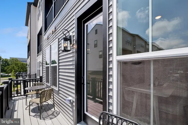 a view of balcony with wooden floor