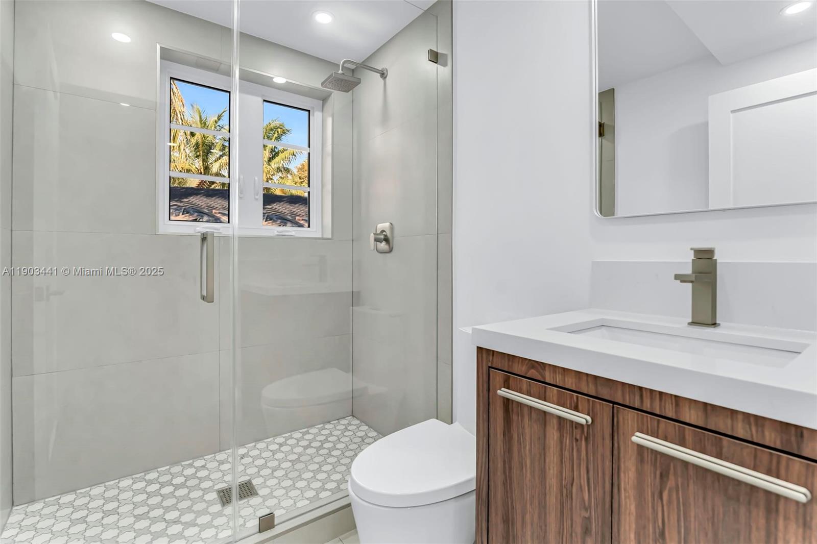 524 Northeast 65th Street, Unit 1 Miami, FL 33138 - Photo 12 of 26 a bathroom with a sink a toilet and shower