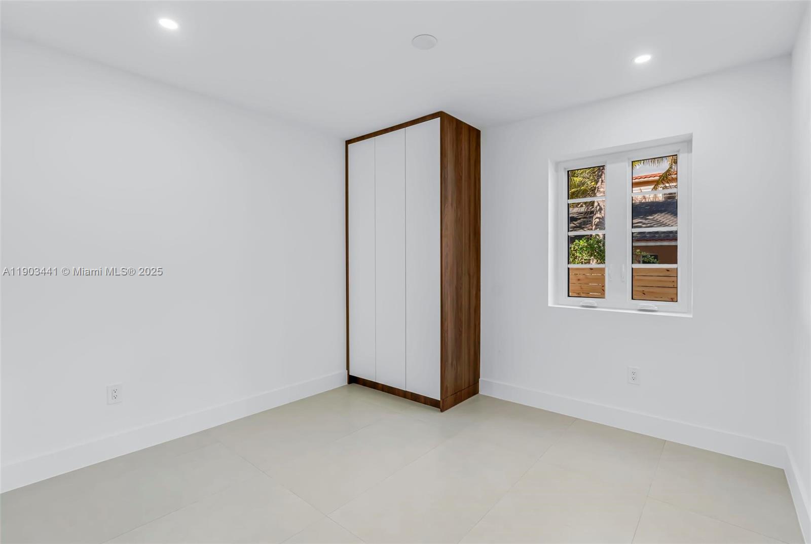 524 Northeast 65th Street, Unit 1 Miami, FL 33138 - Photo 13 of 26 an empty room with windows