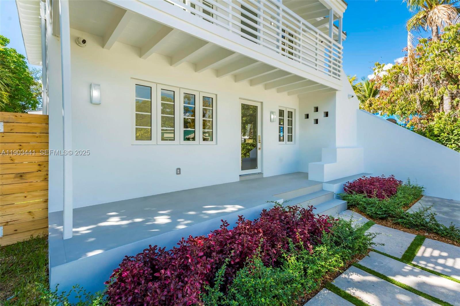 524 Northeast 65th Street, Unit 1 Miami, FL 33138 - Photo 4 of 26 a view of a house with a yard and garden