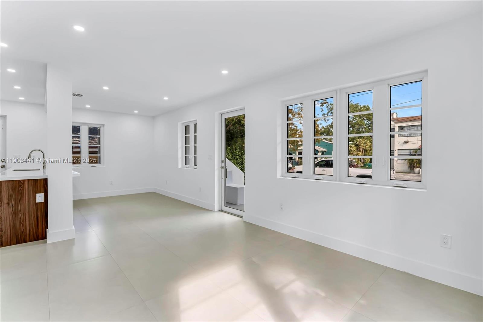 524 Northeast 65th Street, Unit 1 Miami, FL 33138 - Photo 7 of 26 an empty room with windows