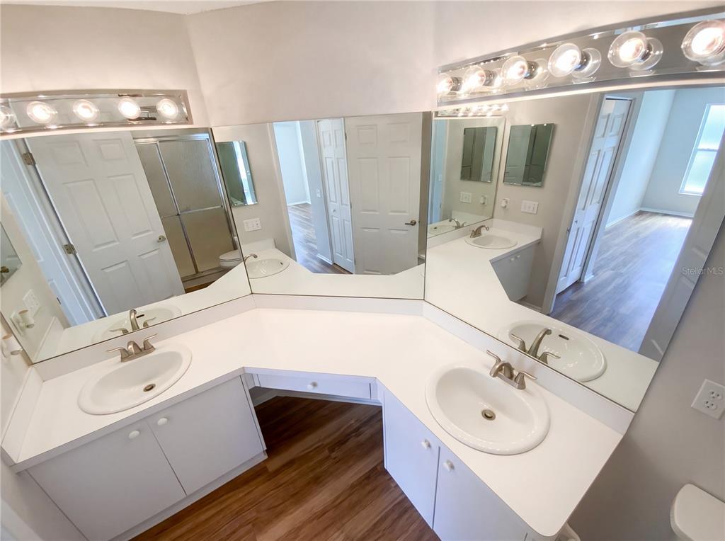 7410 Willowbrook Drive Spring Hill, FL 34606 - Photo 16 of 23 a bathroom with a sink vanity granite tub and shower