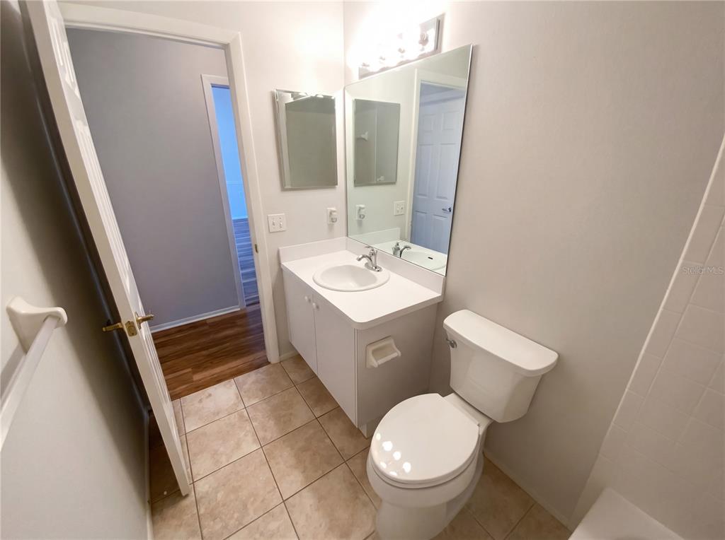 7410 Willowbrook Drive Spring Hill, FL 34606 - Photo 20 of 23 a bathroom with a sink toilet and mirror