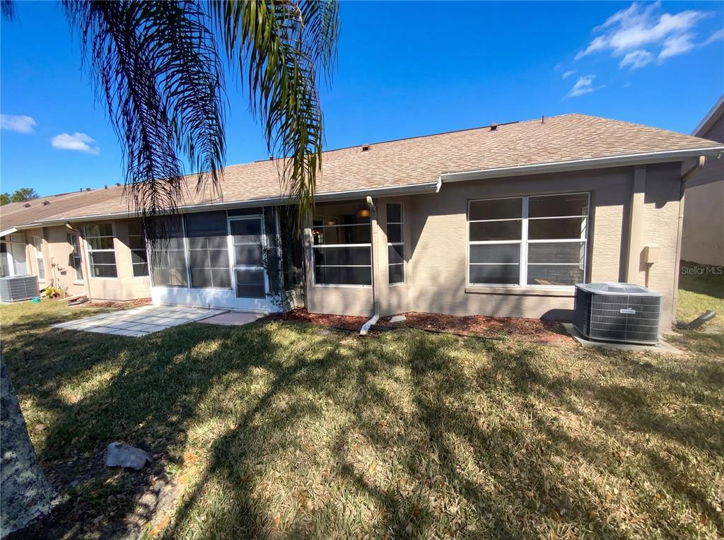 7410 Willowbrook Drive Spring Hill, FL 34606 - Photo 23 of 23 a front view of a house with garden