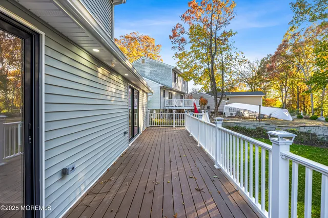 a view of a house with wooden deck