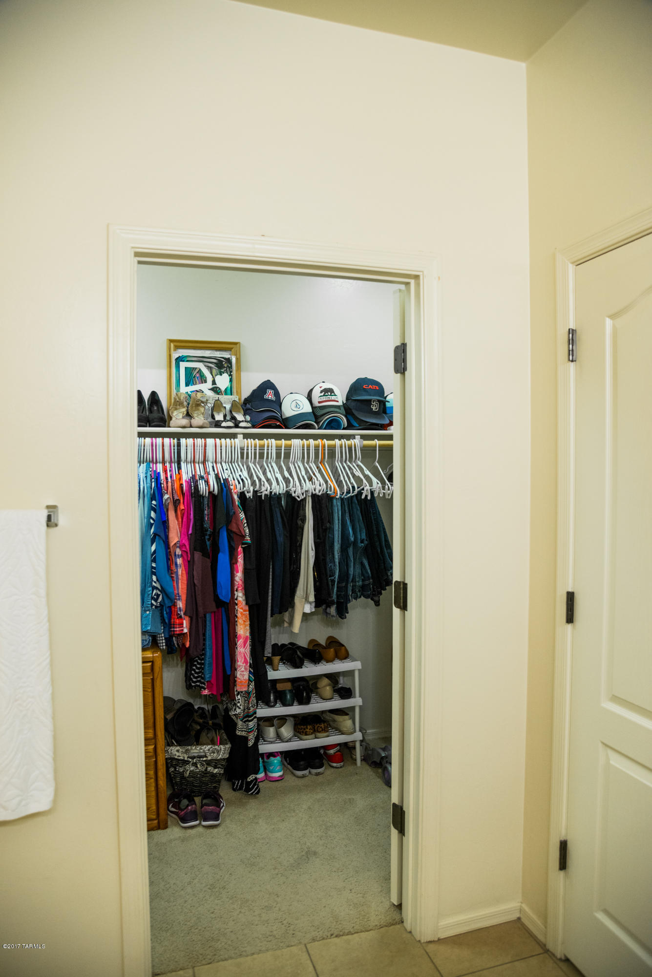 4405 West Crystal Ranch Place Marana, AZ 85658 - Photo 28 of 44 a view of walk in closet with clothes and shoes
