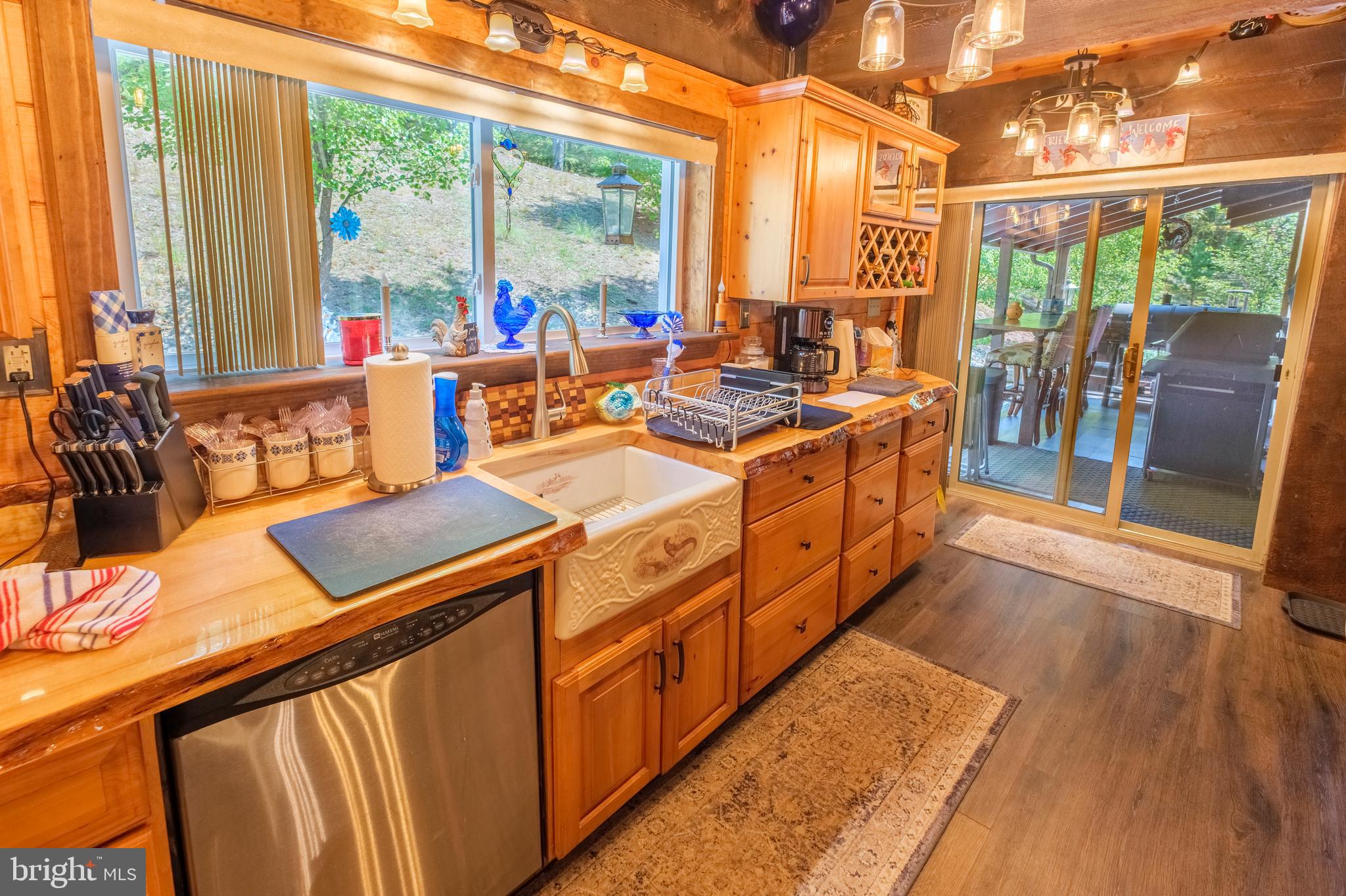 1595 Indian Springs Road Frenchville, PA 16836 - Photo 15 of 86 a open kitchen with stainless steel appliances granite countertop a stove and a wooden cabinets