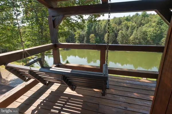 a view of two chairs in a balcony