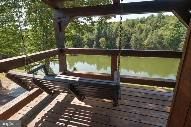 a view of two chairs in a balcony