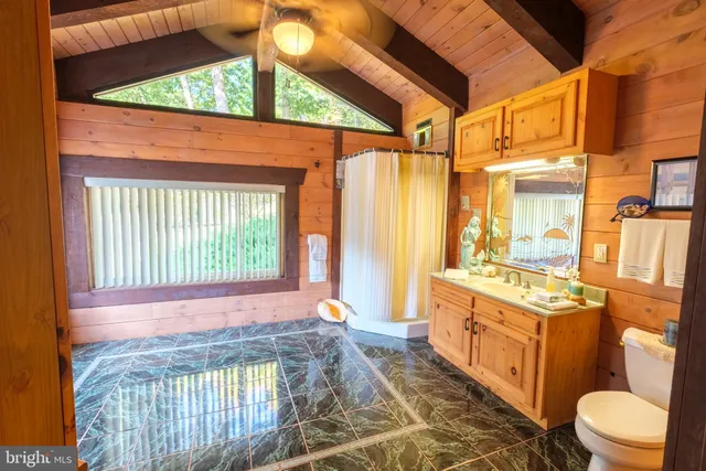 a view of a backyard with sitting area