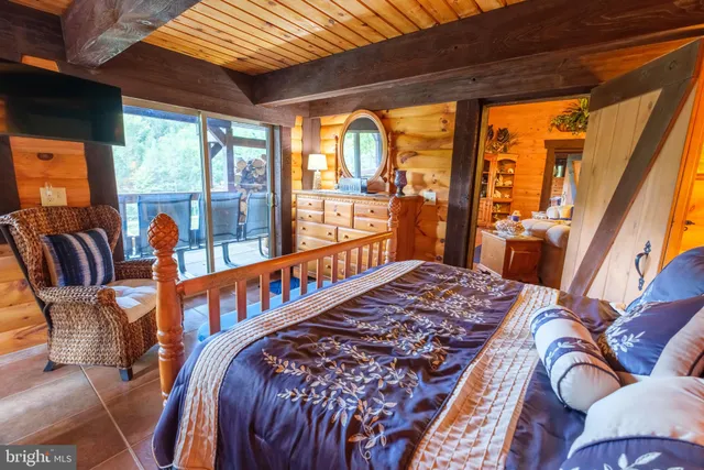 a view of a lake with a bench next to a lake