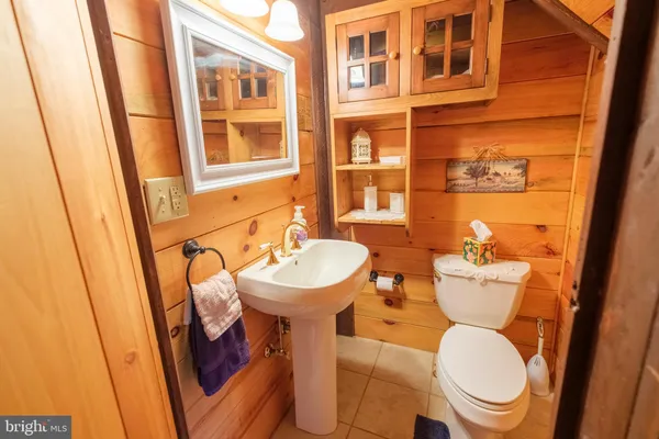a view of a backyard with table and chairs under an umbrella