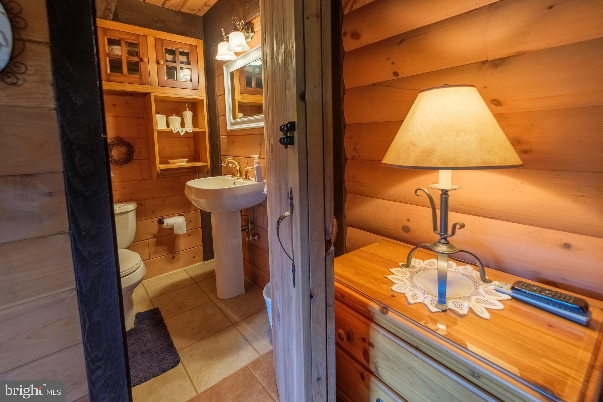 1595 Indian Springs Road Frenchville, PA 16836 - Photo 56 of 86 a bathroom with a sink and a mirror