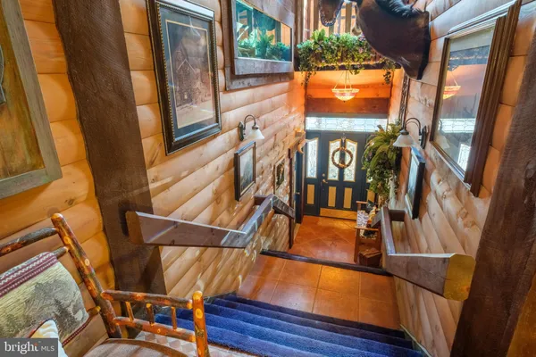 a view of a porch with a table and chairs