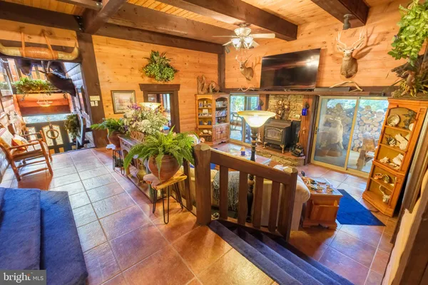 a open kitchen with stainless steel appliances granite countertop a stove and a wooden cabinets