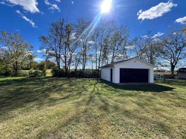 a large tree in front of a house