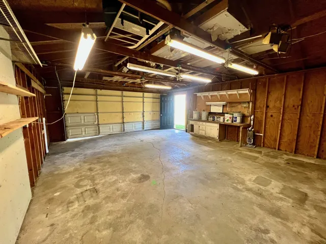 a view of an empty room with storage