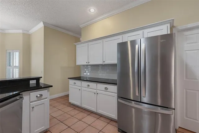 a view of empty room with windows and ceiling fan