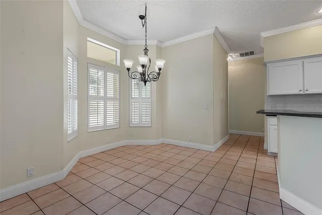 a bathroom with a granite countertop sink tub and mirror