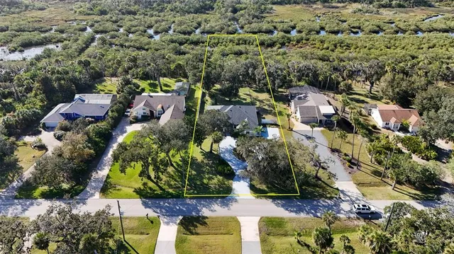 a front view of a house with swimming pool having outdoor seating