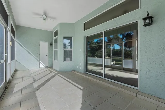 an aerial view of a houses with a yard