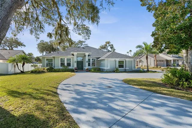 a view of a hallway with furniture and a window