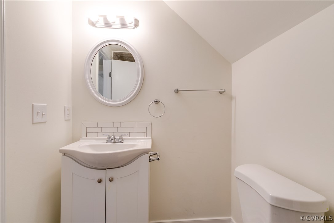 2901 West Strathmore Road North Chesterfield, VA 23237 - Photo 24 of 36 a bathroom with a toilet sink and mirror