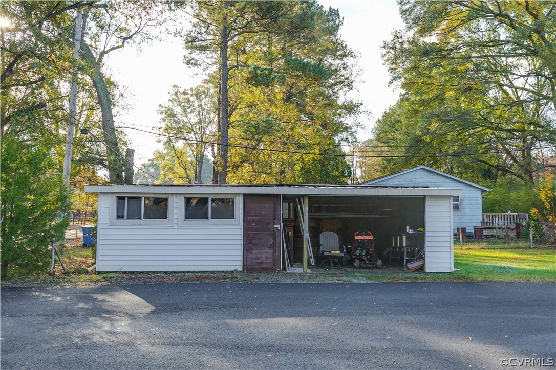 2901 West Strathmore Road North Chesterfield, VA 23237 - Photo 35 of 36 a front view of a house with a yard and garage