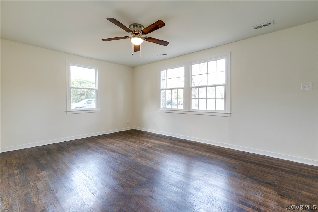 2901 West Strathmore Road North Chesterfield, VA 23237 - Photo 5 of 36 an empty room with wooden floor and windows