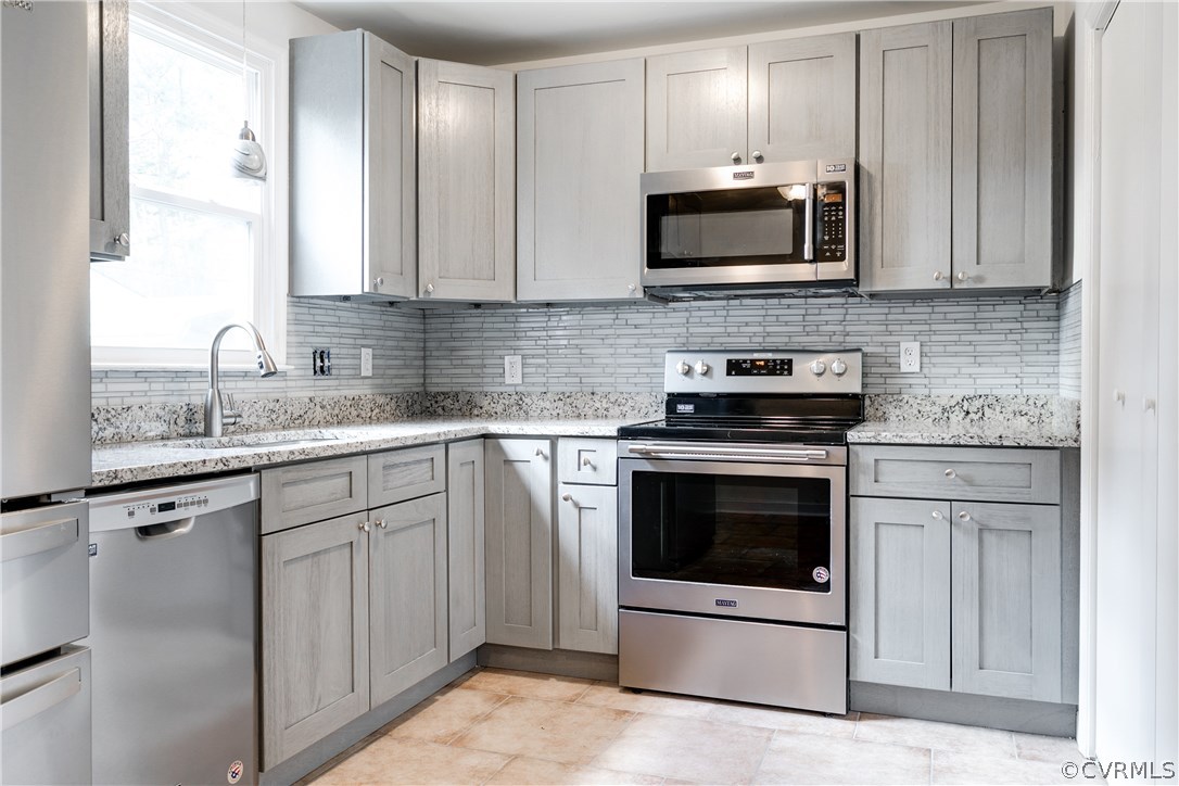 2901 West Strathmore Road North Chesterfield, VA 23237 - Photo 8 of 36 a kitchen with granite countertop white cabinets white stainless steel appliances and a sink