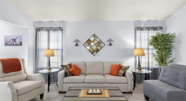 a living room with furniture and a window