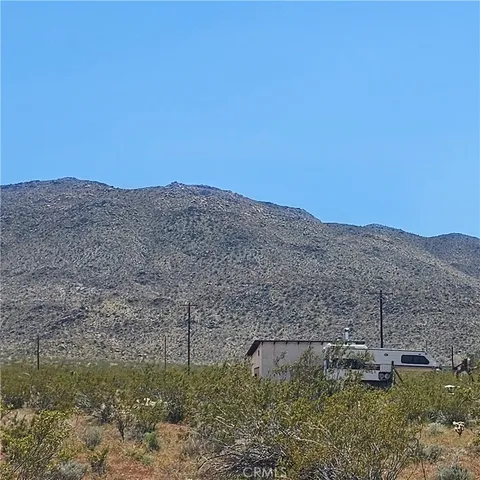 a living room with furniture a rug and a window