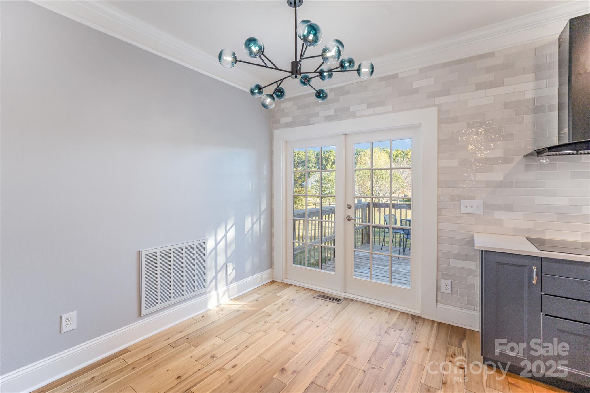 2870 Harmony Road Rock Hill, SC 29730 - Photo 11 of 29 a view of an empty room with wooden floor and a window
