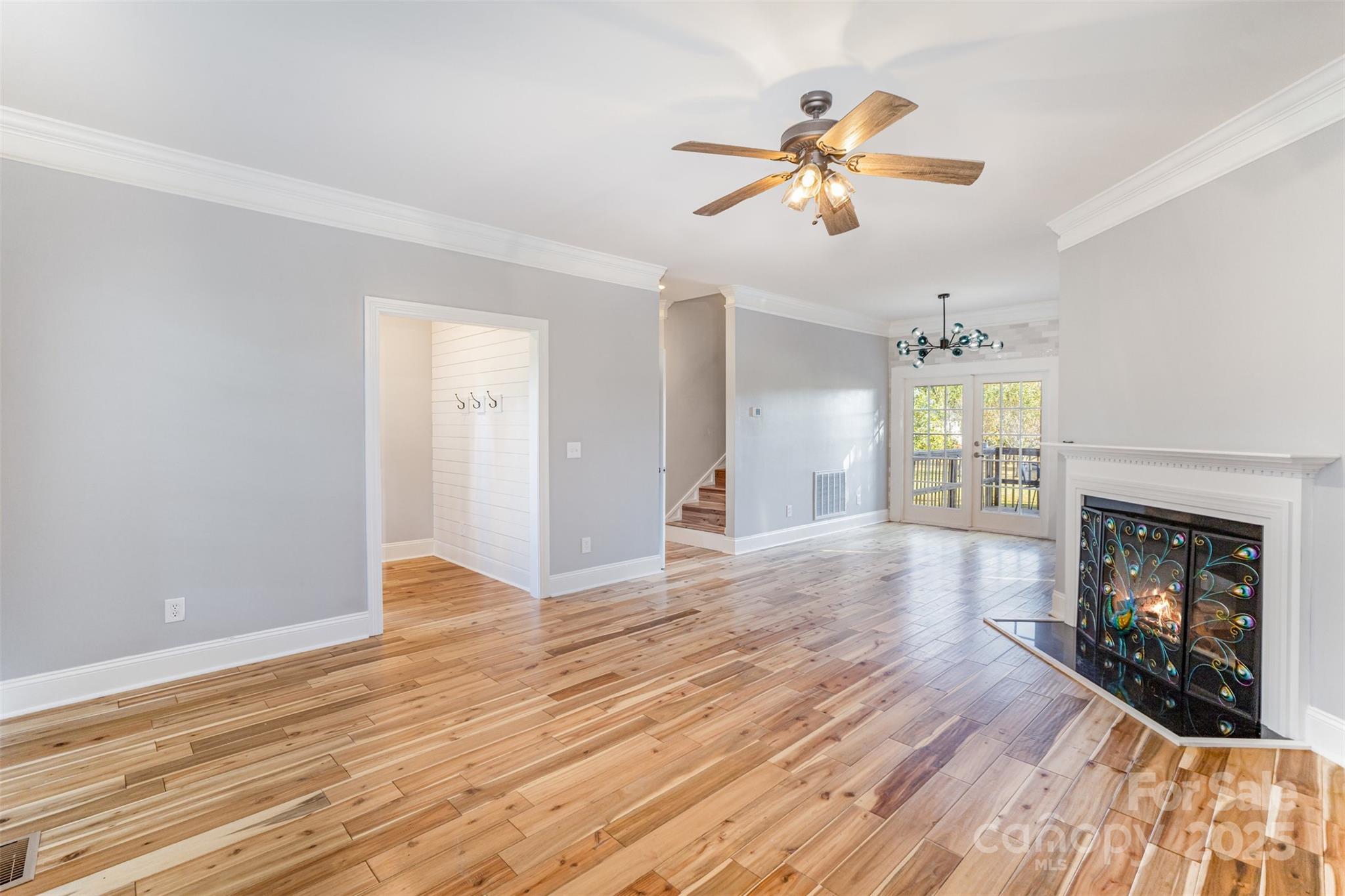 2870 Harmony Road Rock Hill, SC 29730 - Photo 13 of 29 a view of an empty room with wooden floor fireplace and a window