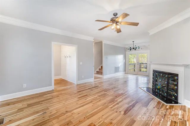 wooden floor in an empty room with a fireplace