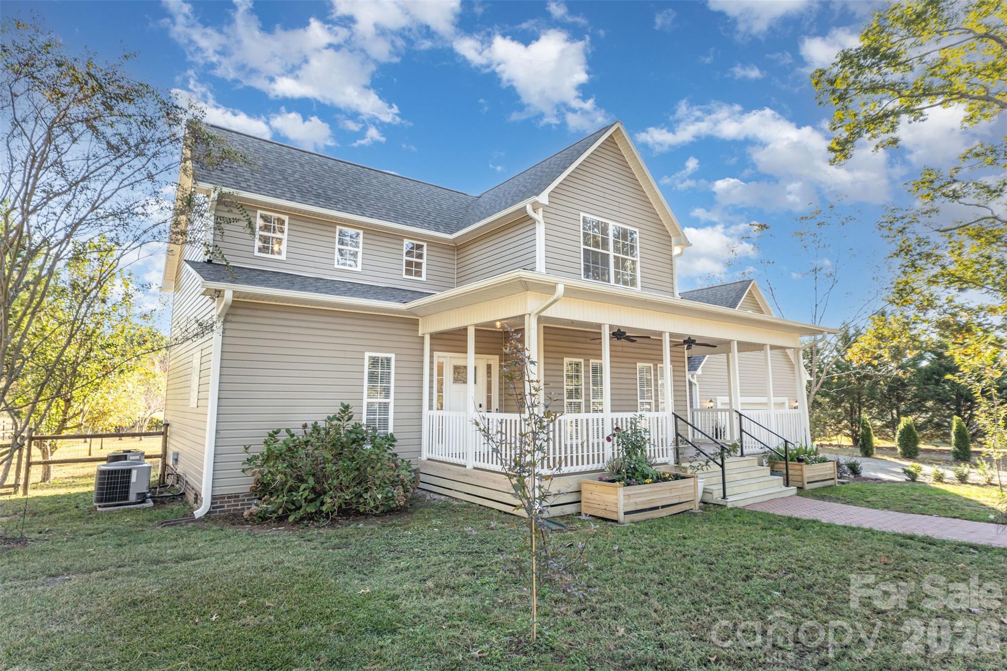 2870 Harmony Road Rock Hill, SC 29730 - Photo 23 of 26 a front view of a house with a yard table and chairs