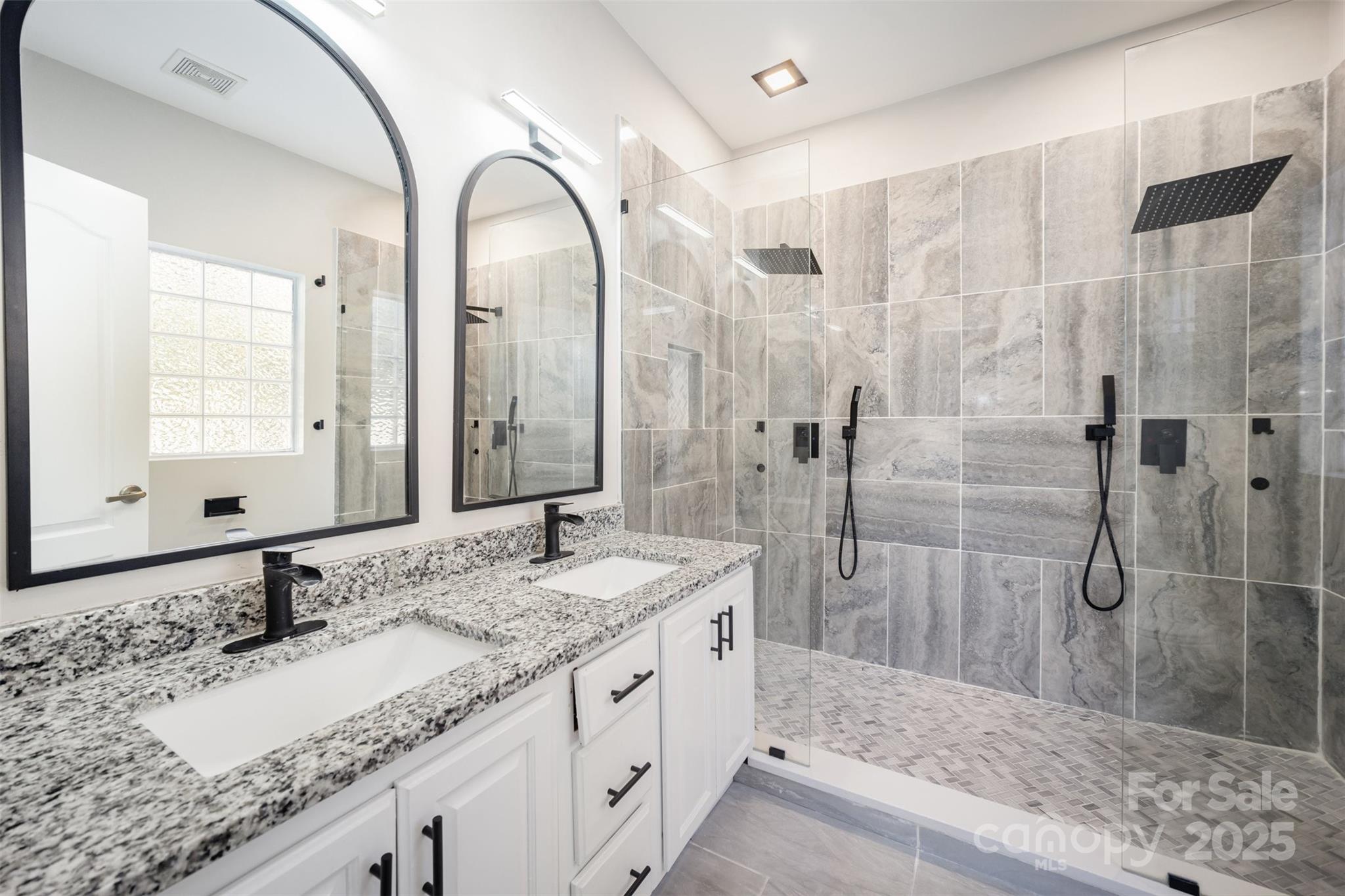 2870 Harmony Road Rock Hill, SC 29730 - Photo 5 of 29 a bathroom with a granite countertop sink and a mirror