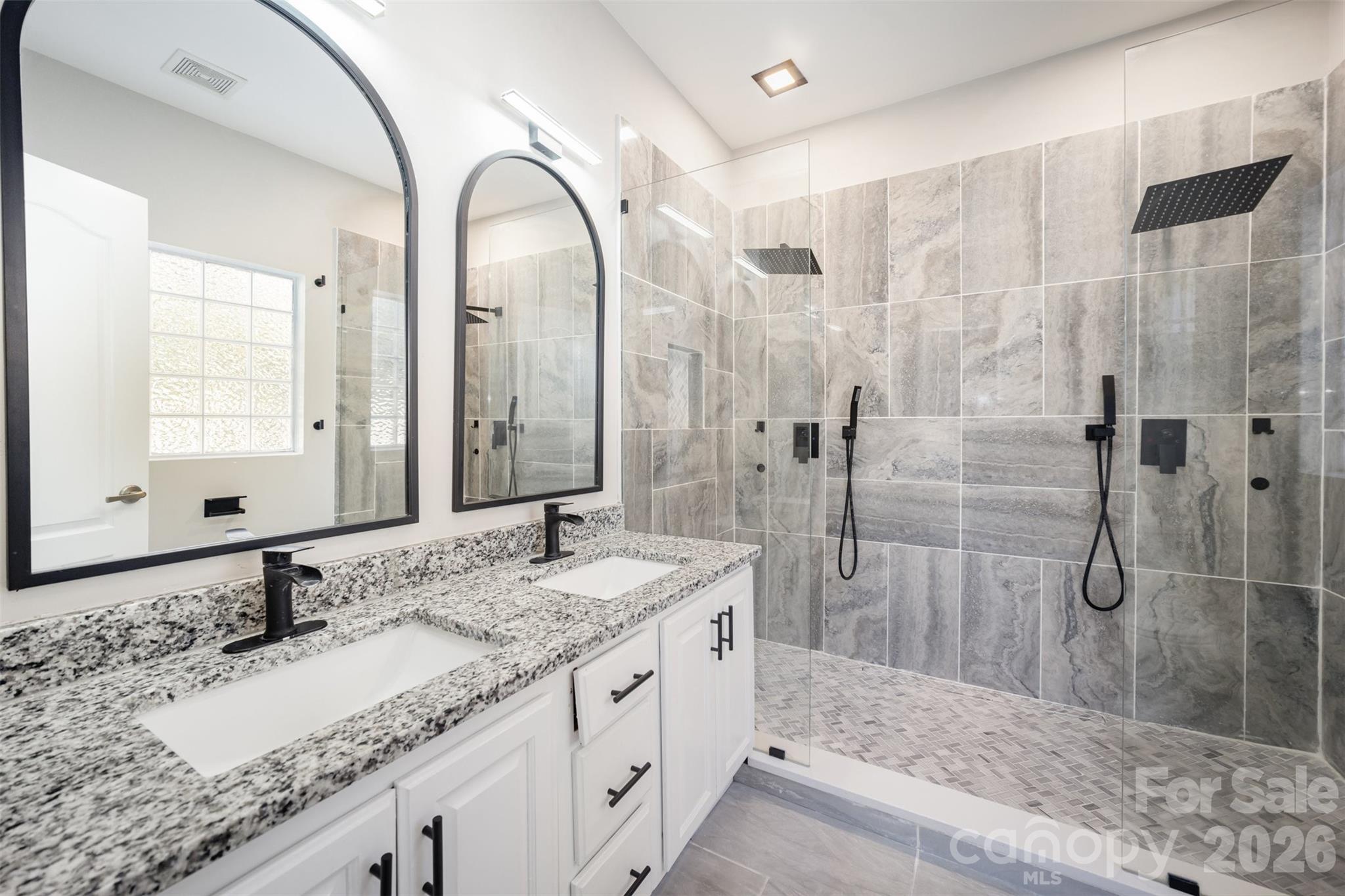 2870 Harmony Road Rock Hill, SC 29730 - Photo 7 of 26 a bathroom with a granite countertop sink and a mirror