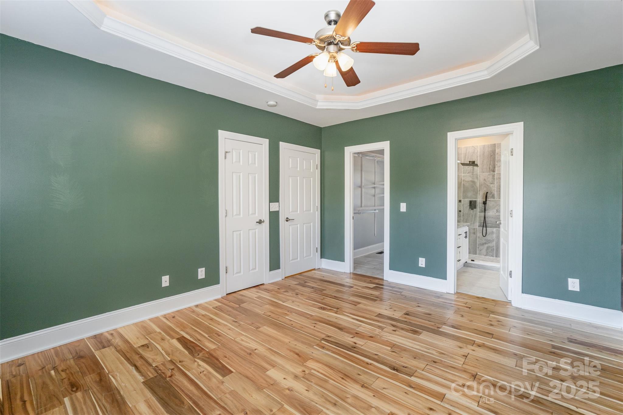 2870 Harmony Road Rock Hill, SC 29730 - Photo 7 of 29 a bedroom with a bed and a chandelier fan