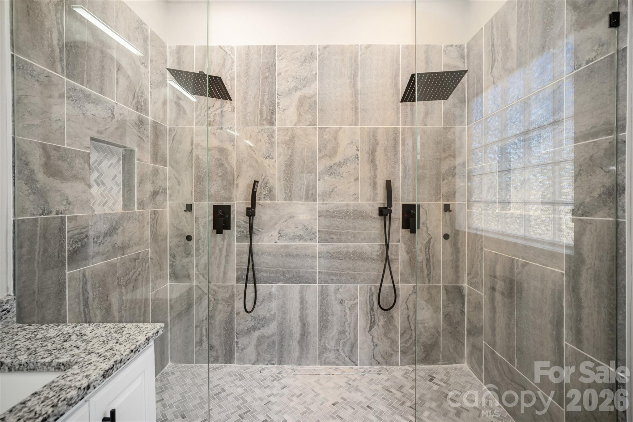 2870 Harmony Road Rock Hill, SC 29730 - Photo 8 of 26 a bathroom with a granite countertop shower a sink and a mirror