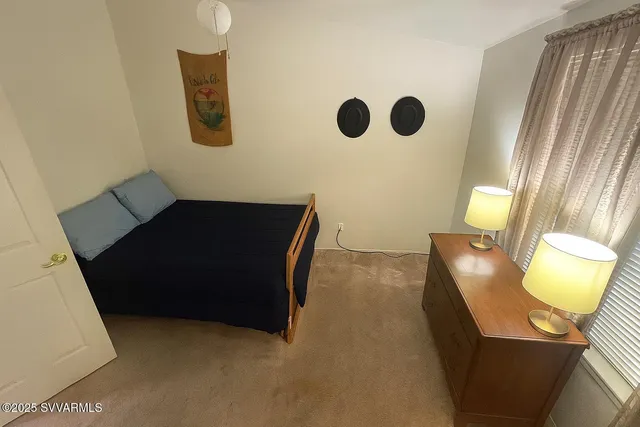 a view of a hallway with furniture