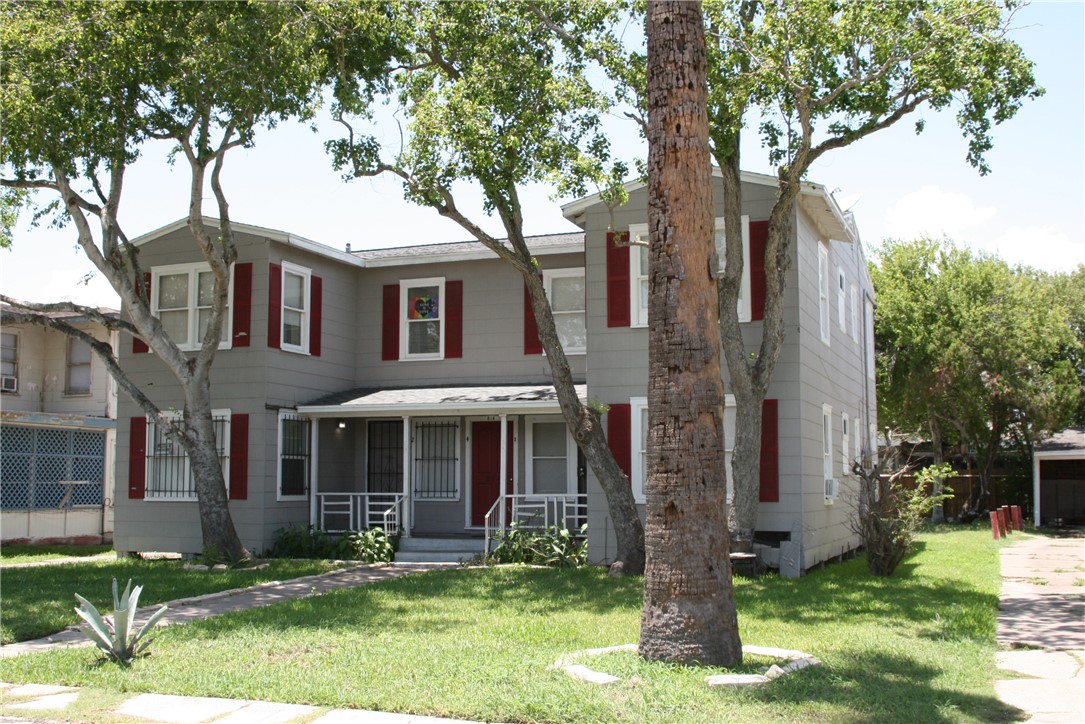 814 Ohio Avenue, Unit 2 Corpus Christi, TX 78404 - Photo 2 of 9 front view of a house with a yard