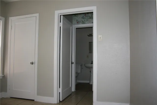 a view of a bathroom from a hallway