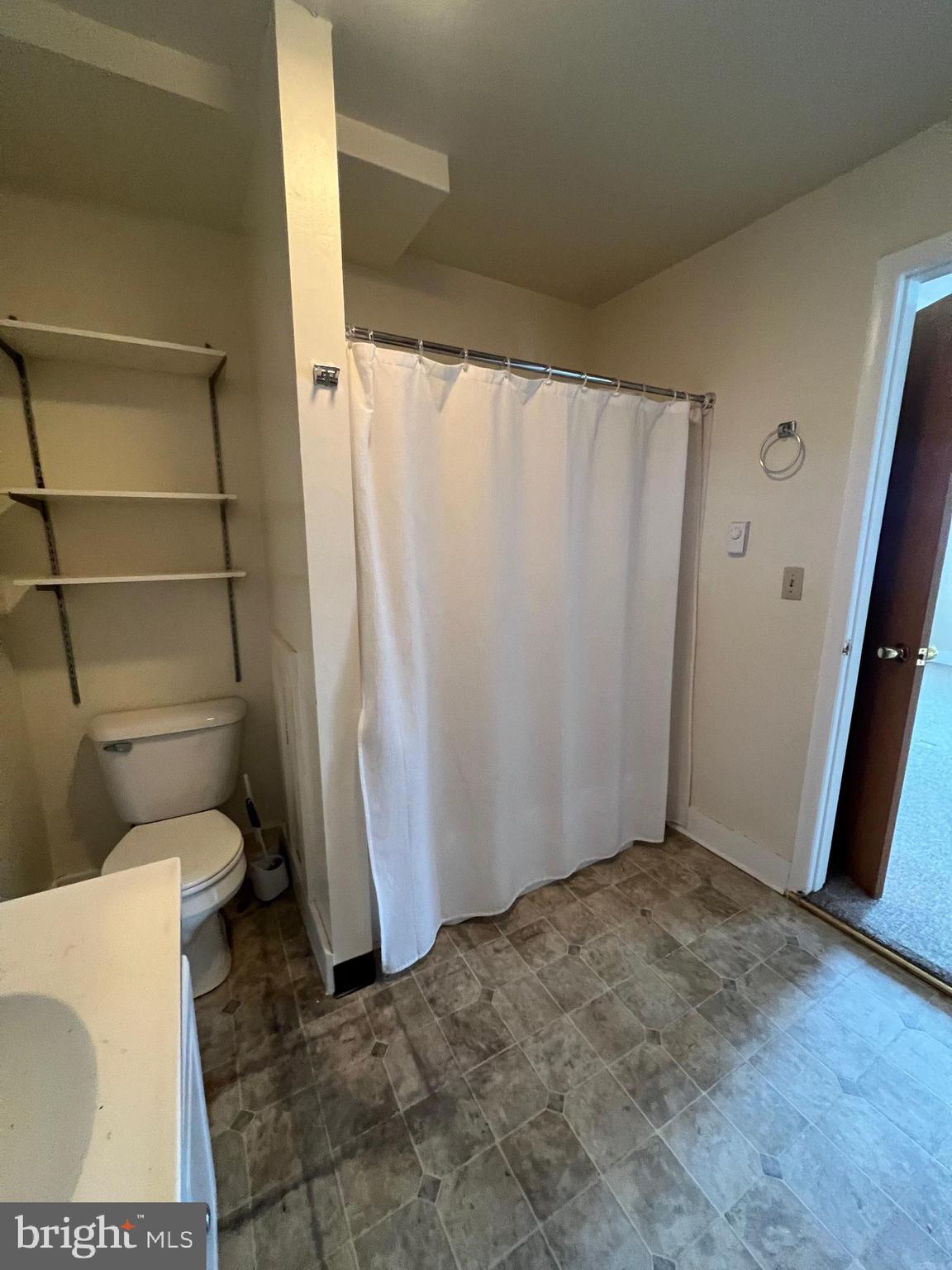 1354 Wiltshire Road, Unit 2 Kearneysville, WV 25430 - Photo 2 of 6 a bathroom with a toilet and a shower
