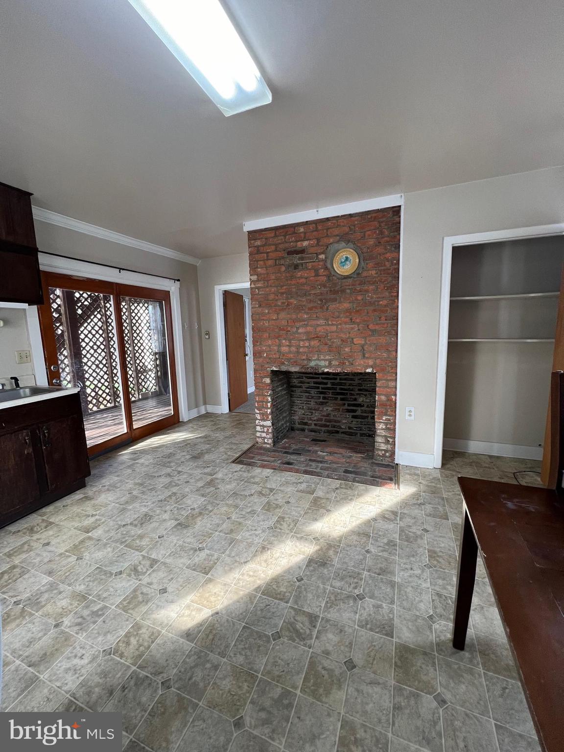 1354 Wiltshire Road, Unit 2 Kearneysville, WV 25430 - Photo 4 of 6 a view of an empty room with a fireplace and a window