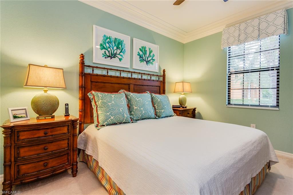 9082 Capistrano Street North, Unit 485 Naples, FL 34113 - Photo 8 of 16 a bedroom with a bed and window